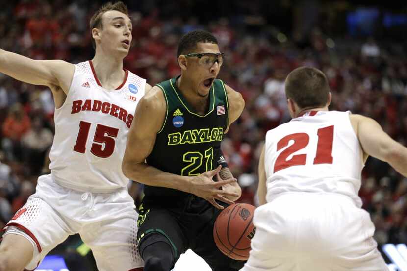 Baylor center Isaiah Austin (21) is pressured by Wisconsin's Sam Dekker (15) and Josh Gasser...
