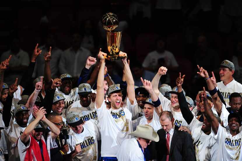 (FILES) In this file photo taken on June 12, 2011 Dirk Nowitzki (C) of the Dallas Mavericks...