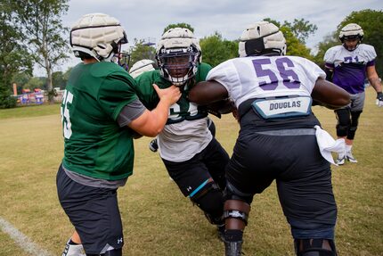 Stephen F. Austin Lumberjacks offensive linemen go through drills during practice in...