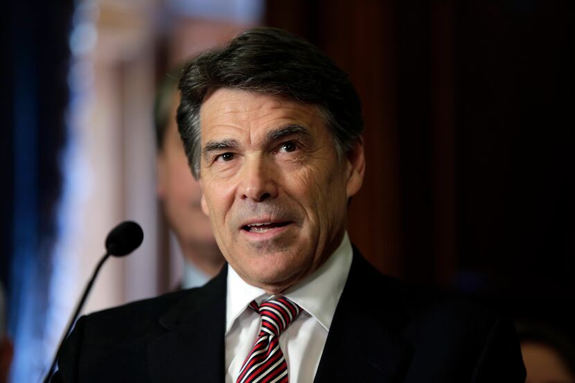 FILE - In this May 28, 2013, file photo, Gov. Rick Perry speaks during a ceremonial signing...