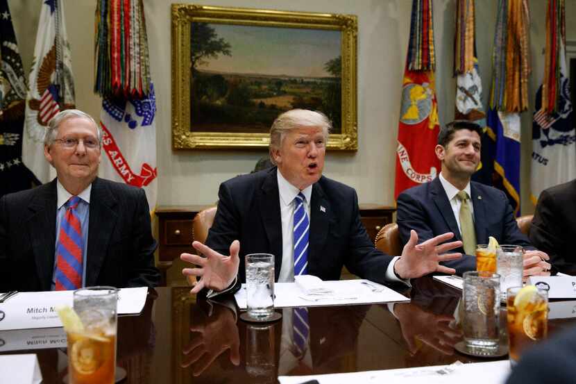 FILE - In this March 1, 2017 file photo, President Donald Trump, flanked by Senate Majority...