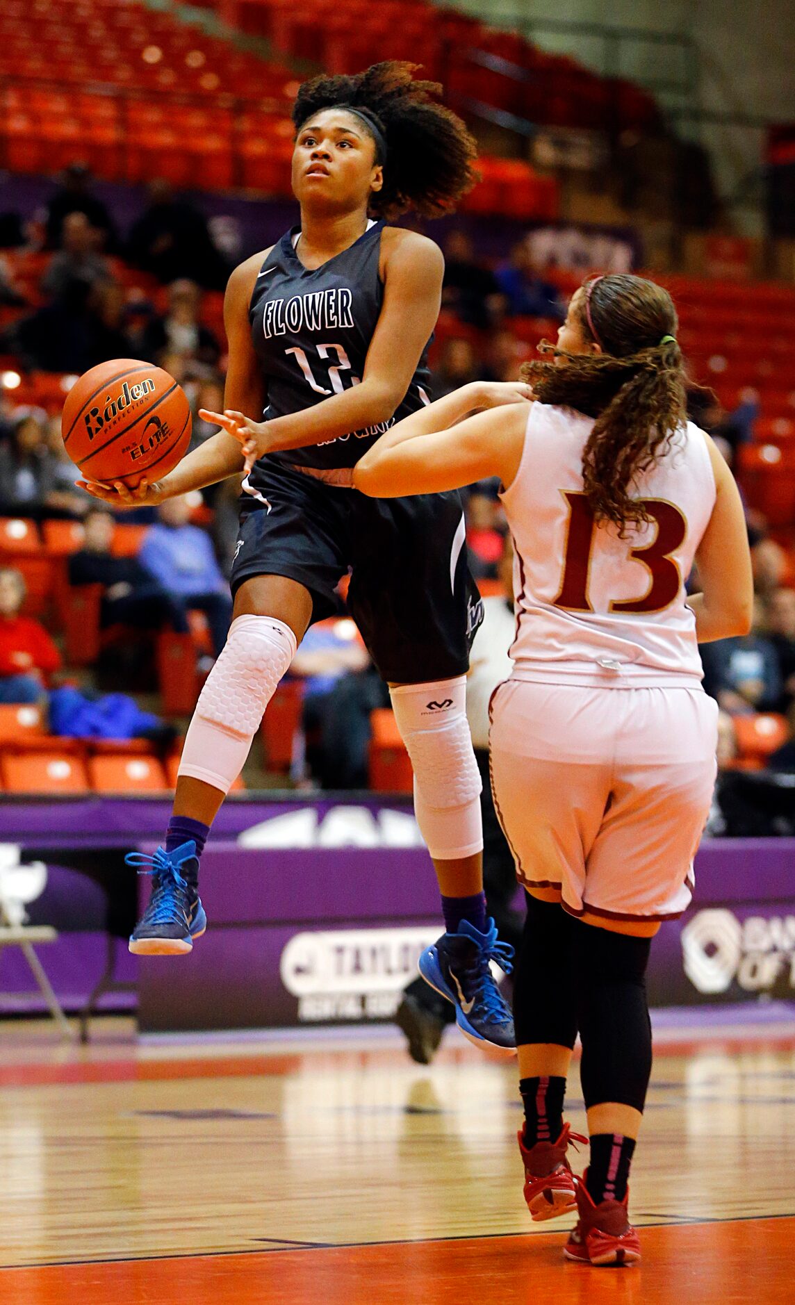 Flower Mound guard Courtney Fields (12) lays up a shot past El Paso El Dorado guard Ciara...