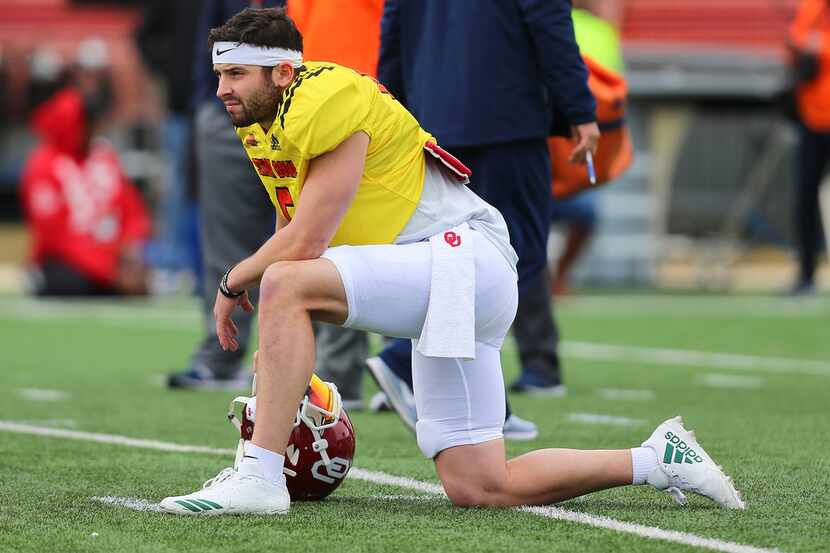 North Squad quarterback Baker Mayfield of Oklahoma kneels during the North teams practice...