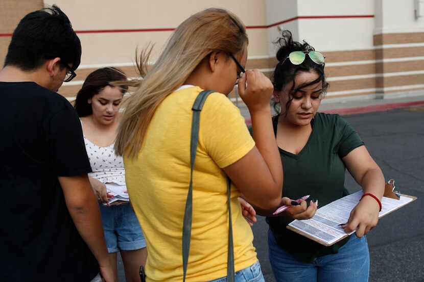 Maria Nieto (right) and Alma Romo (second from left) registered people to vote in Las Vegas...