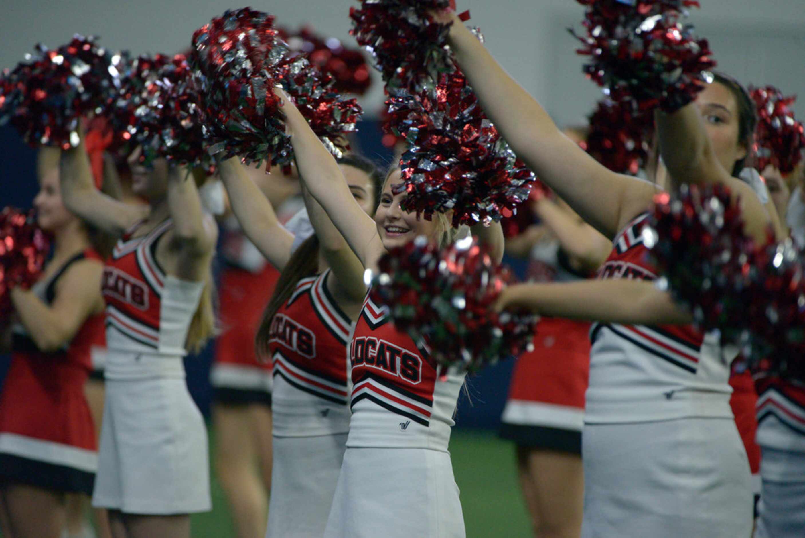 Lake Highlands cheerleaders in the first half of a Class 6A Division II area round high...