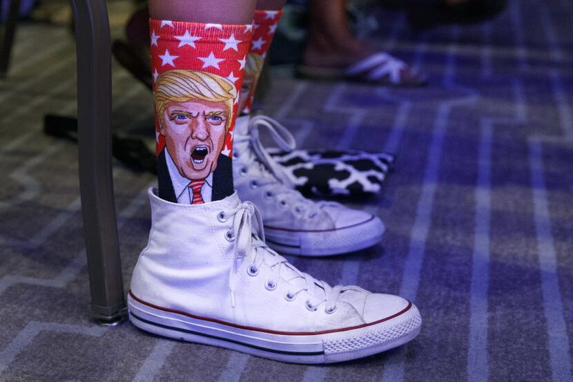 A supporter shows off a pair of Donald Trump socks during a speech by the Republican...