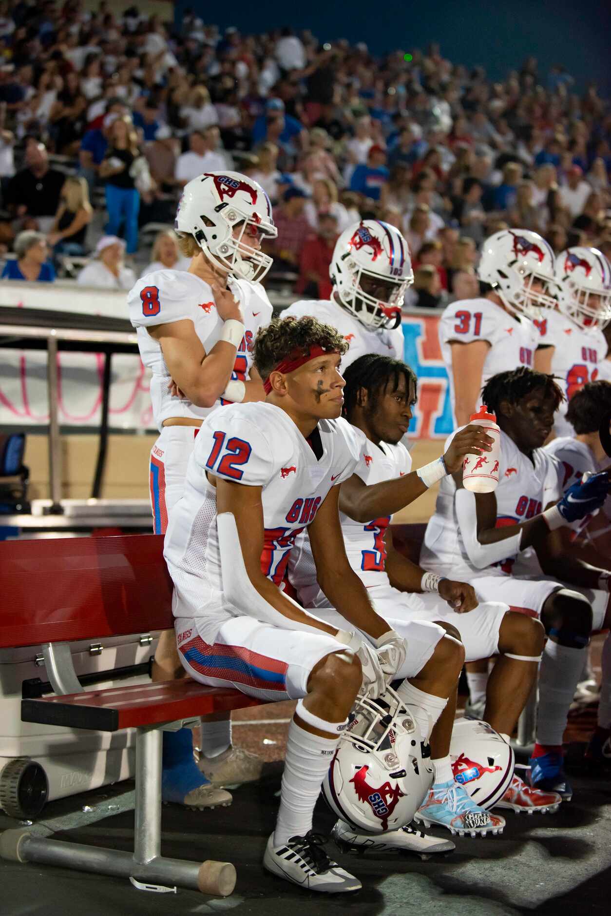 Grapevine senior Ezekiel Brown (12) watches the game while taking a break during a District...