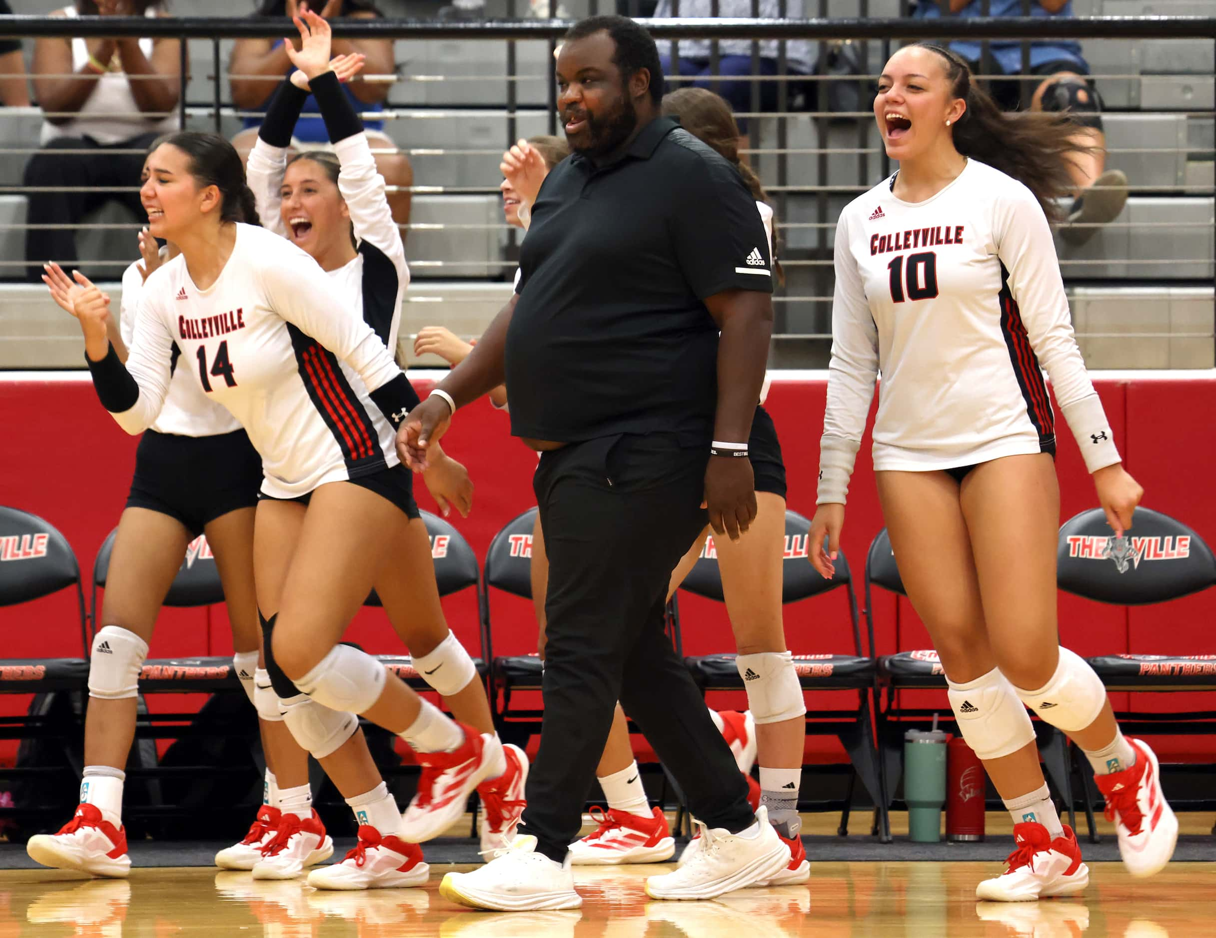 Colleyville Heritage head volleyball coach Josh McKinney reacts with the team bench...