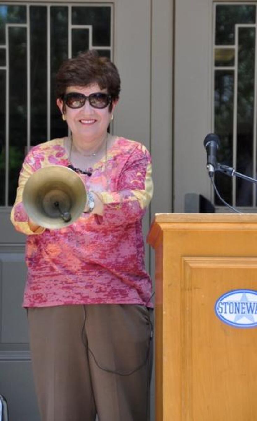 
Stonewall Jackson Elementary’s former principal, Olivia Henderson, rings the school bell...