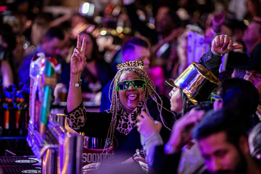 Revelers celebrate the last few minutes of 2019 during the Lone Star NYE Live celebration at...