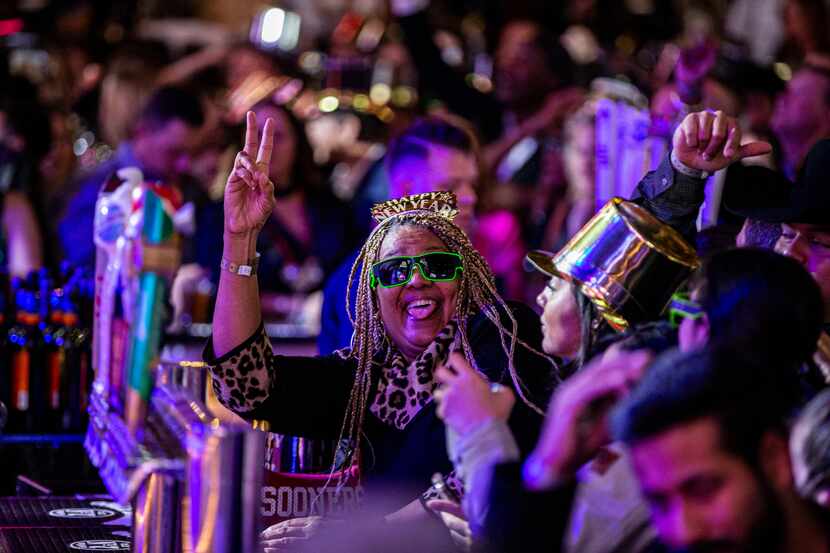 Revelers celebrate the last few minutes of 2019 during the Lone Star NYE Live celebration at...