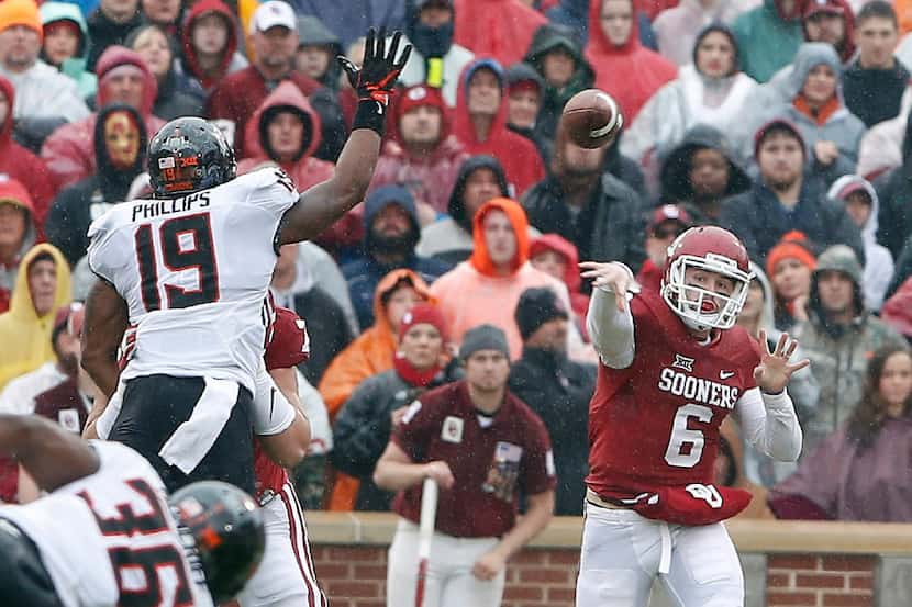 Oklahoma quarterback Baker Mayfield (6) passes against Oklahoma State in the first half of...