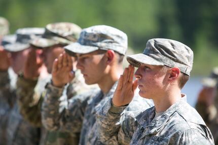 First Lt. Shaye Haver (right) of Copperas Cove in Central Texas saluted during her...
