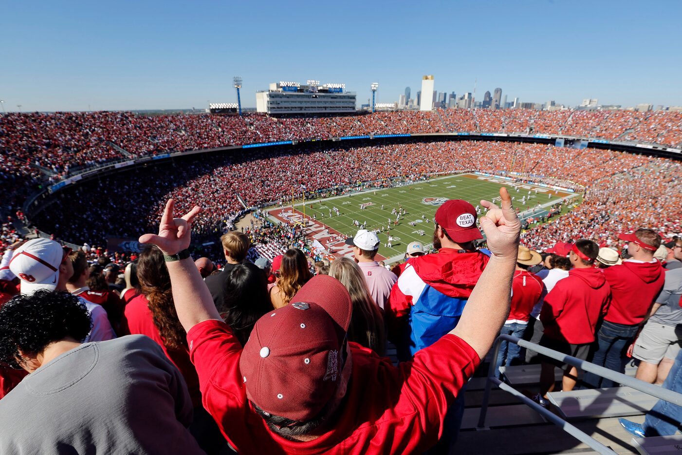 Mark Ross of Ada, Okla., celebrates as the Oklahoma Sooners take the field before playing...