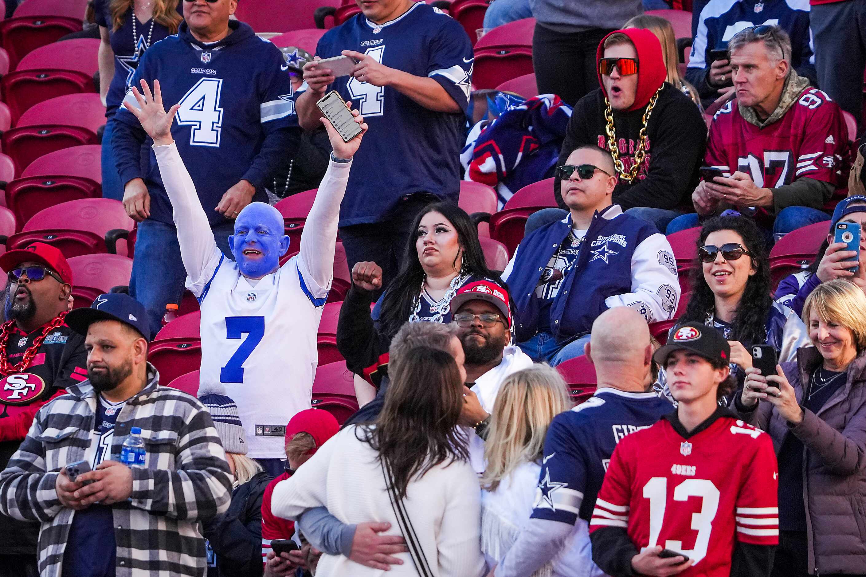 Dallas Cowboys fans cheer their team before an NFL divisional round playoff football game...