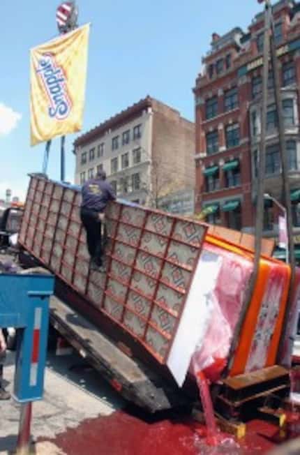  A 25-foot-long, 17 1/2-ton popsicle made of frozen Snapple melts in New YorkÂ onÂ Tuesday,...