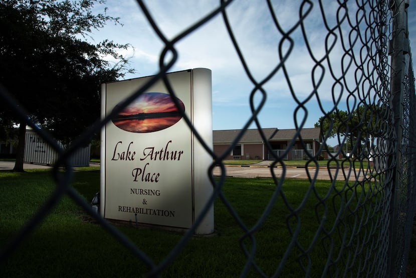 A fence surrounds the vacant Lake Arthur Place nursing home on August 20, 2018, The nursing...