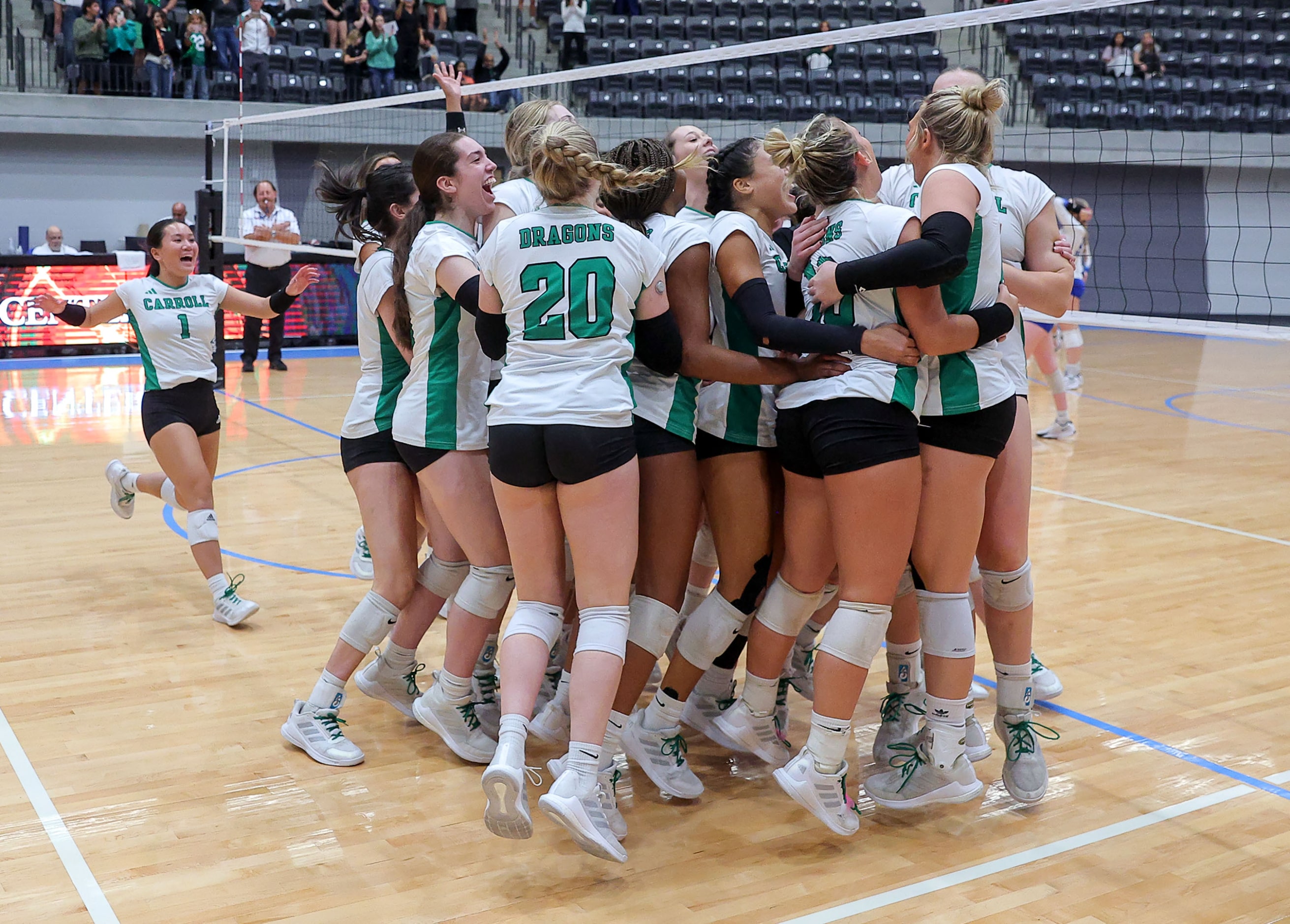 The Southlake Carroll Lady Dragons celebrate their victory over Hebron, 3-0 in the Class 6A...