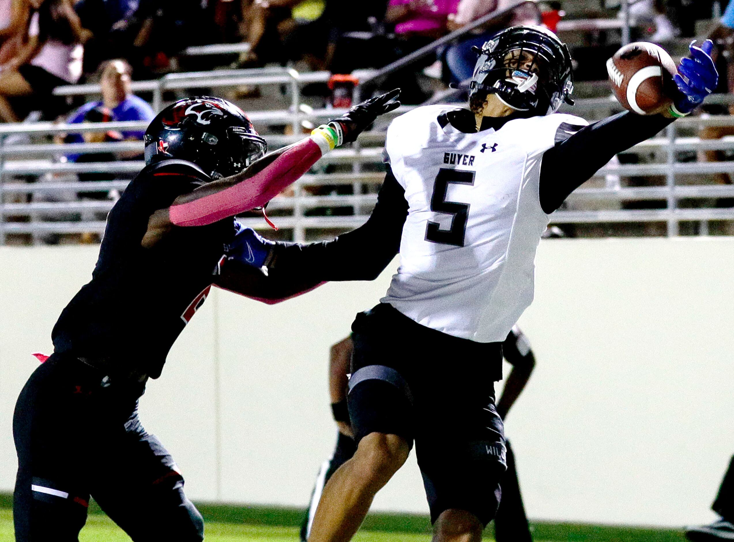 Denton Guyer wide receiver Jace Wilson (5) tries to come up with a one handed reception...