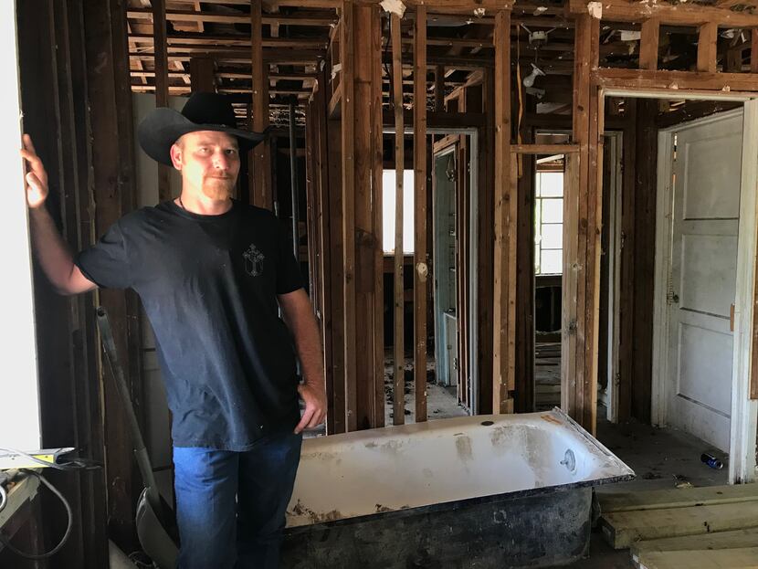 Chris Ward, 33, pictured at the family home he and his brother are remodeling in La Vernia,...