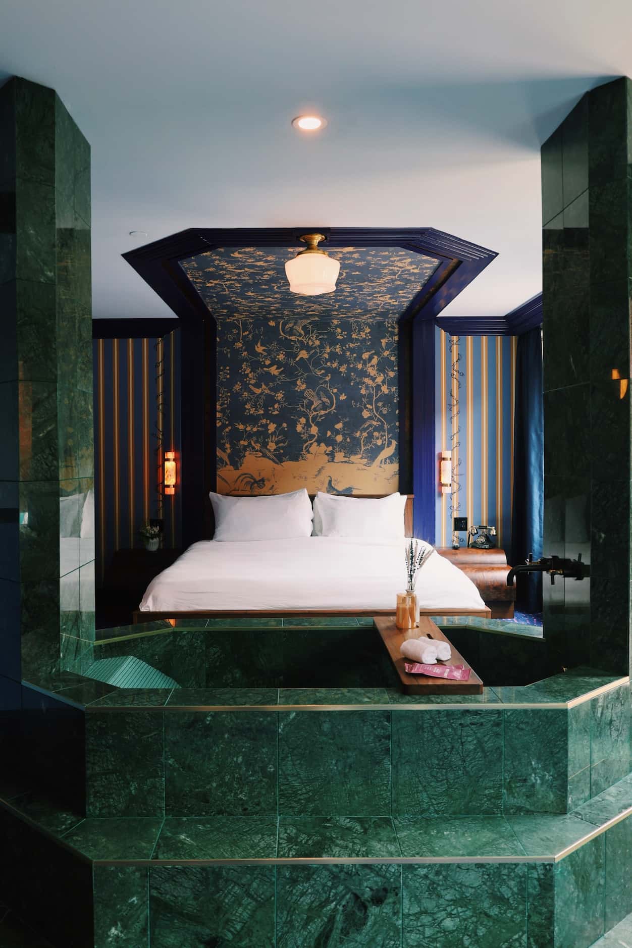 A tub, at the foot of the bed? Hotel Herringbone in Waco is a design-forward inn, in a city...