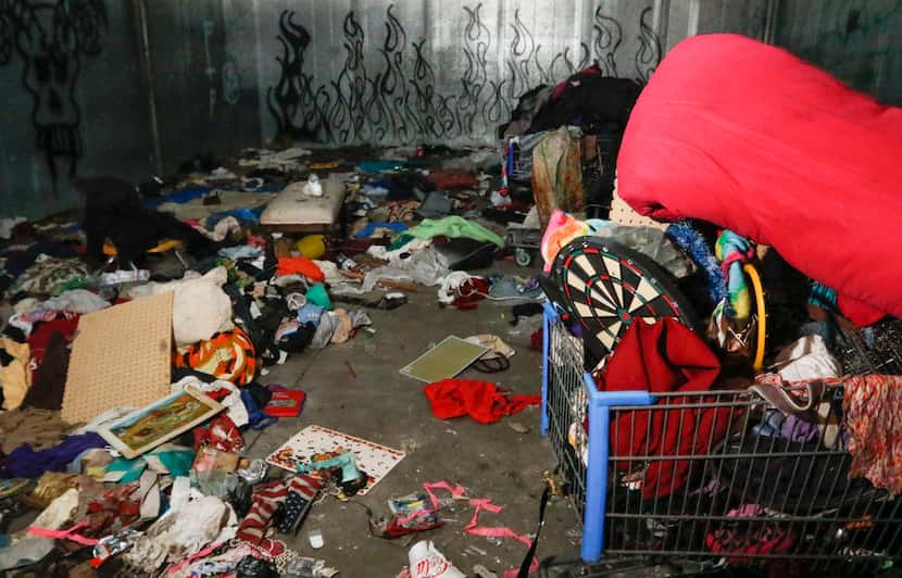 Signs of the homeless living in the produce cooler remain in the former Hypermart in Garland.