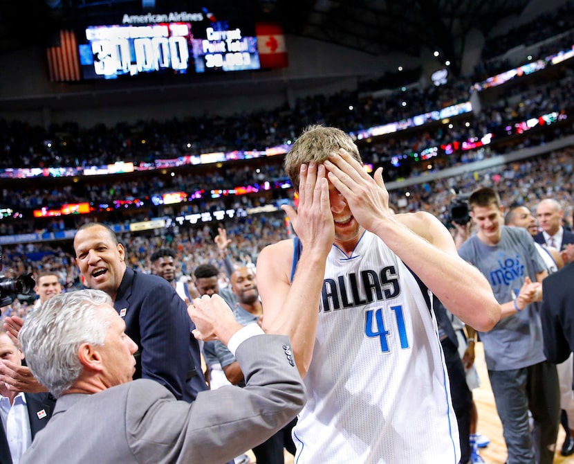 Dallas Mavericks forward Dirk Nowitzki (41) reacts after surpassing the 30,000 point mark...