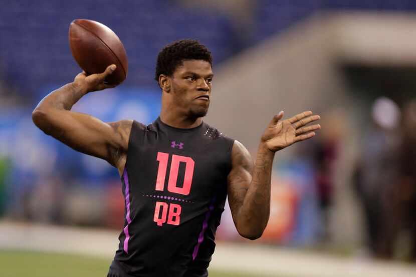 Louisville quarterback Lamar Jackson runs a drill at the NFL football scouting combine in...