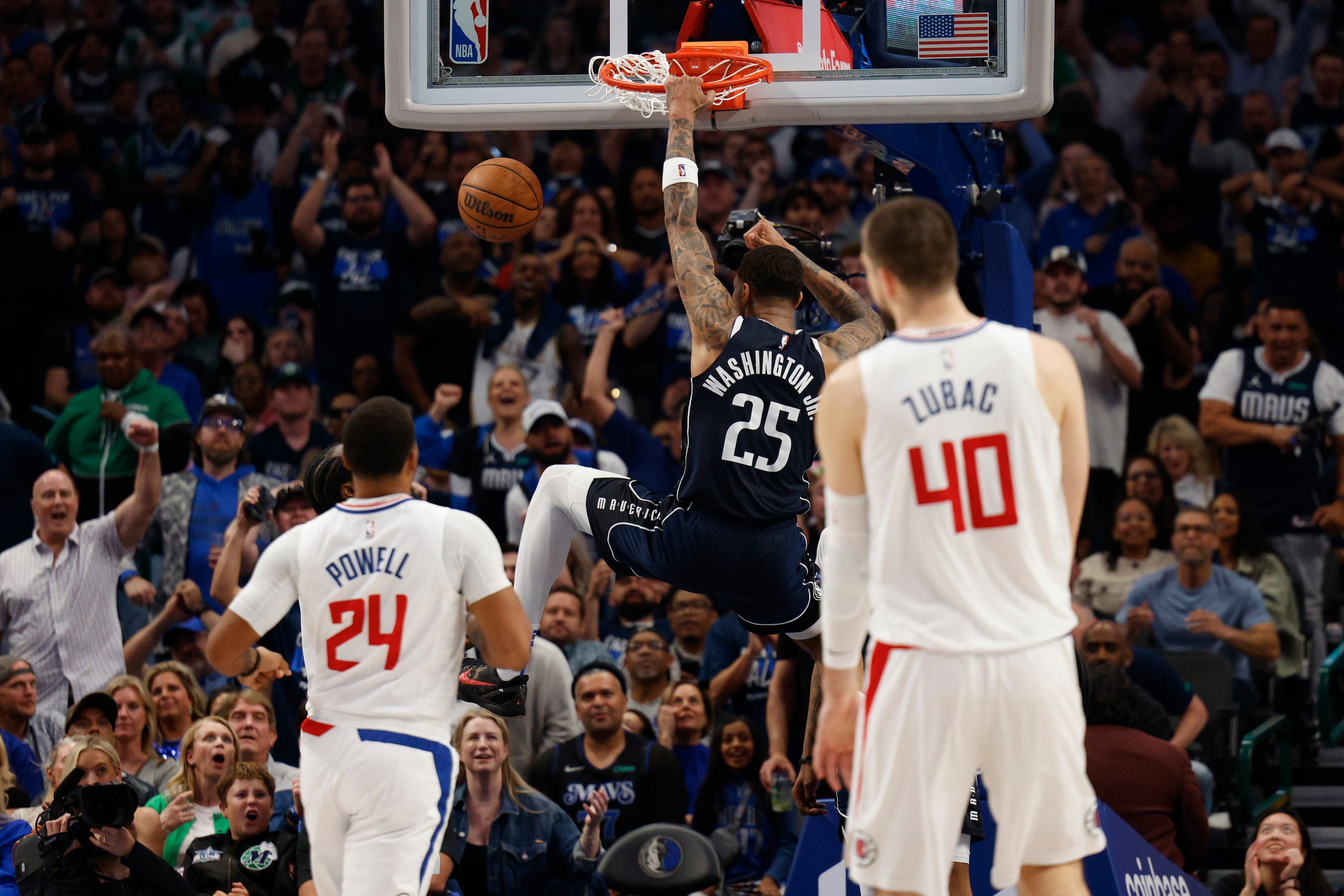 Dallas Mavericks forward P.J. Washington (25) dunks the ball as LA Clippers guard Norman...