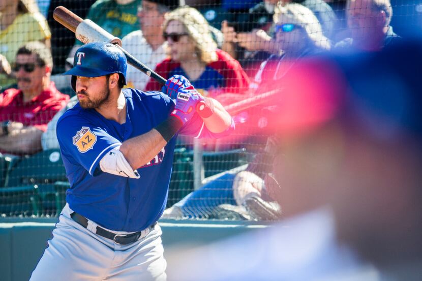 Texas Rangers designated hitter Joey Gallo (13) warms up before batting during the fifth...