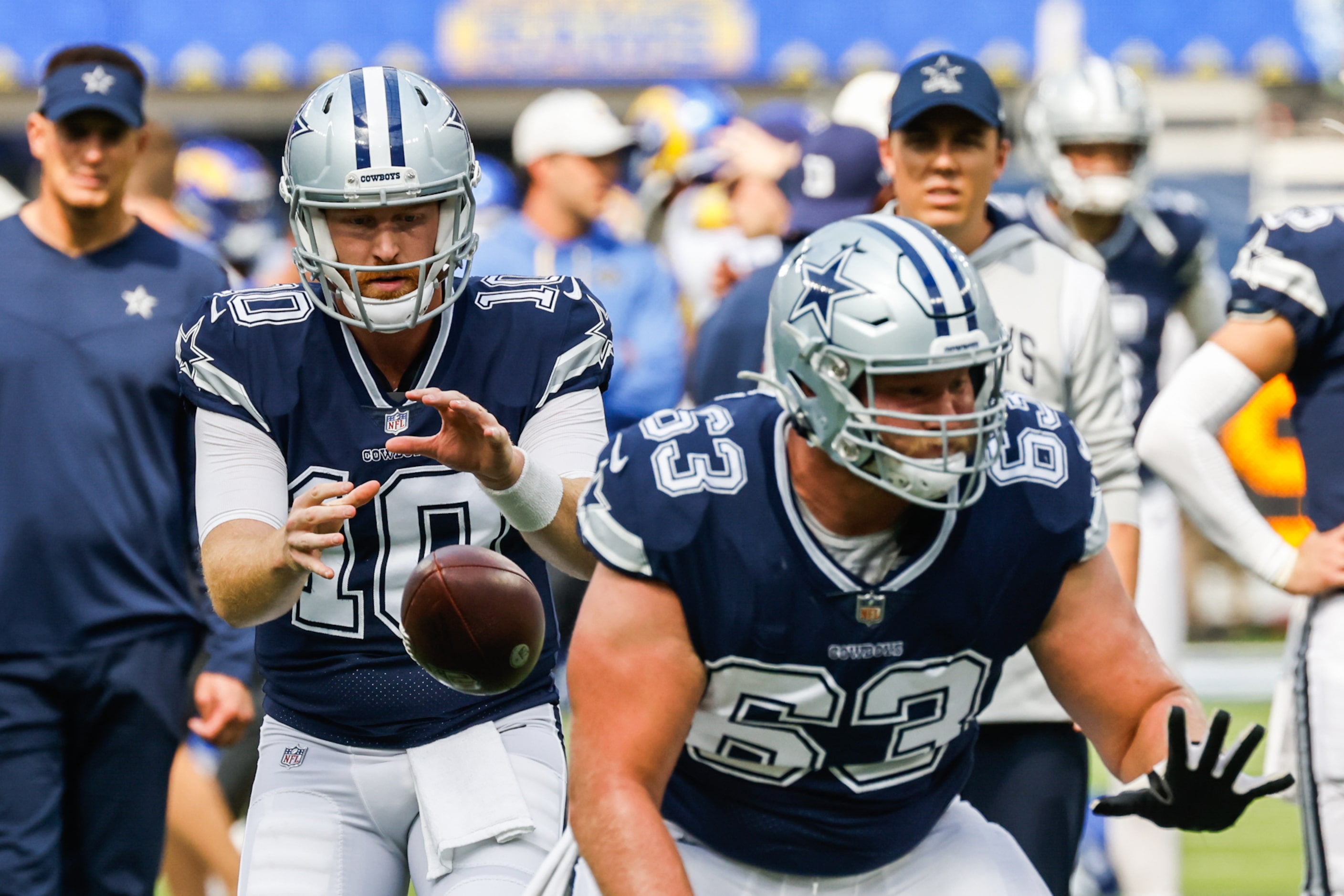 Dallas Cowboys quarterback Cooper Rush (10) and center Tyler Biadasz (63) during warmup at...