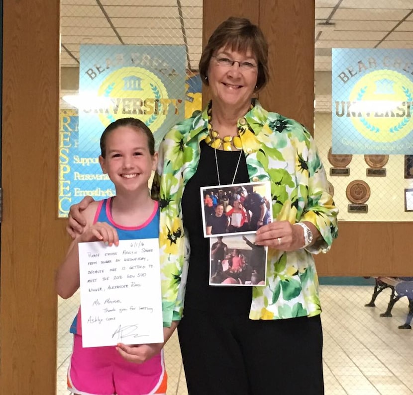 Ashlyn Speed shows her letter from Indianapolis 500 champion Alexander Rossi, with Bear...