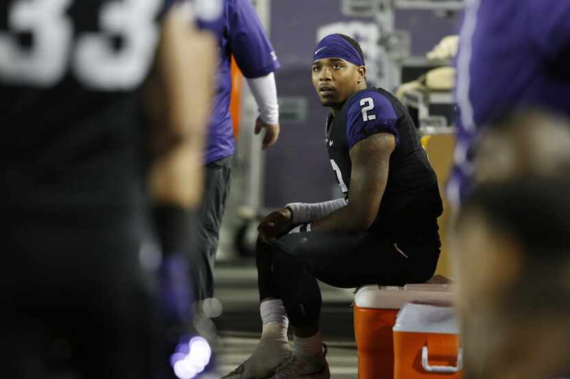 TCU Horned Frogs quarterback Trevone Boykin (2) watches the final minutes from the bench...
