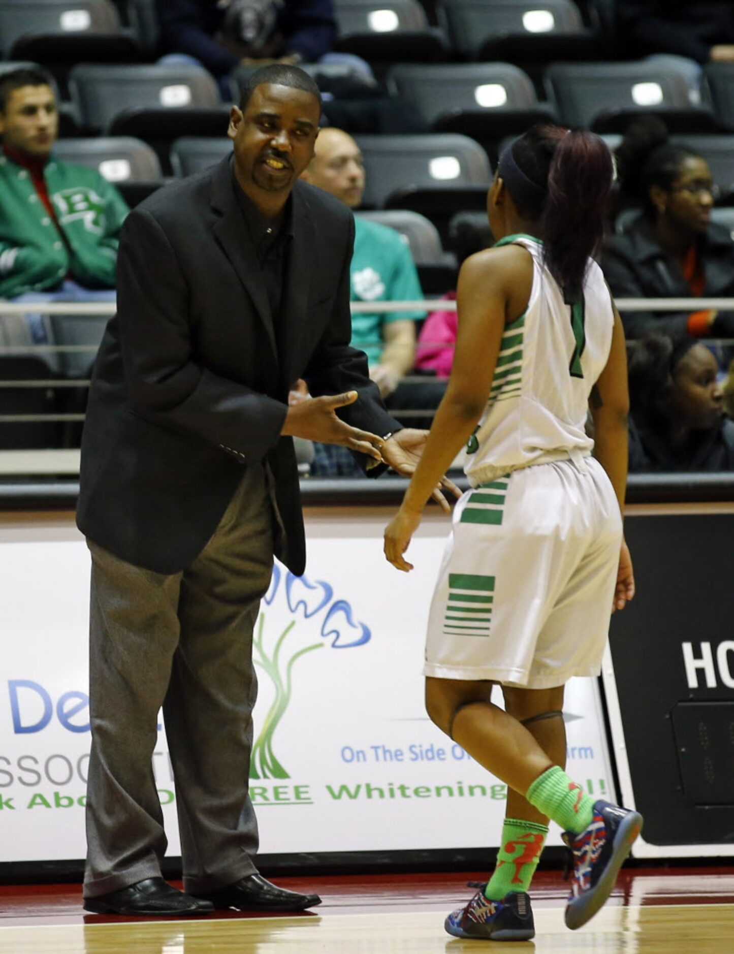 Bryan Adams head coach Darren Eubanks  talks with Dada Nixon (1) during the Class 5A Region...