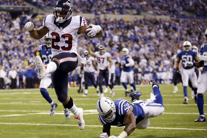 FILE - In this Dec. 14, 2014, file photo, Houston Texans running back Arian Foster (23) gets...