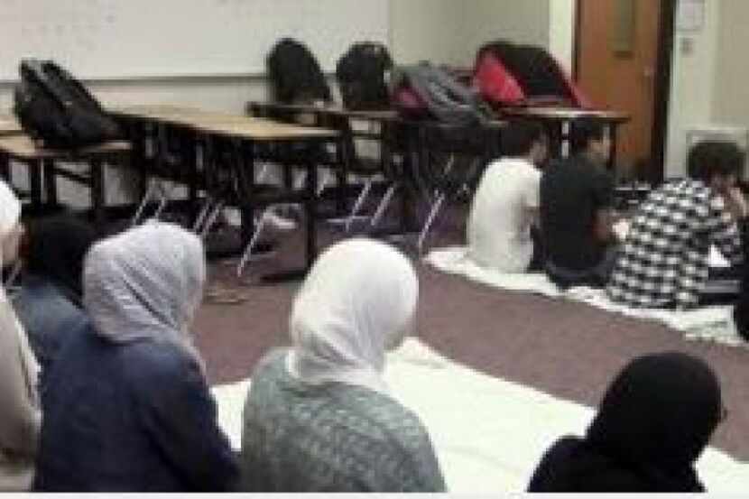 Muslim students at Liberty High School use an empty classroom during a teacher's planning...