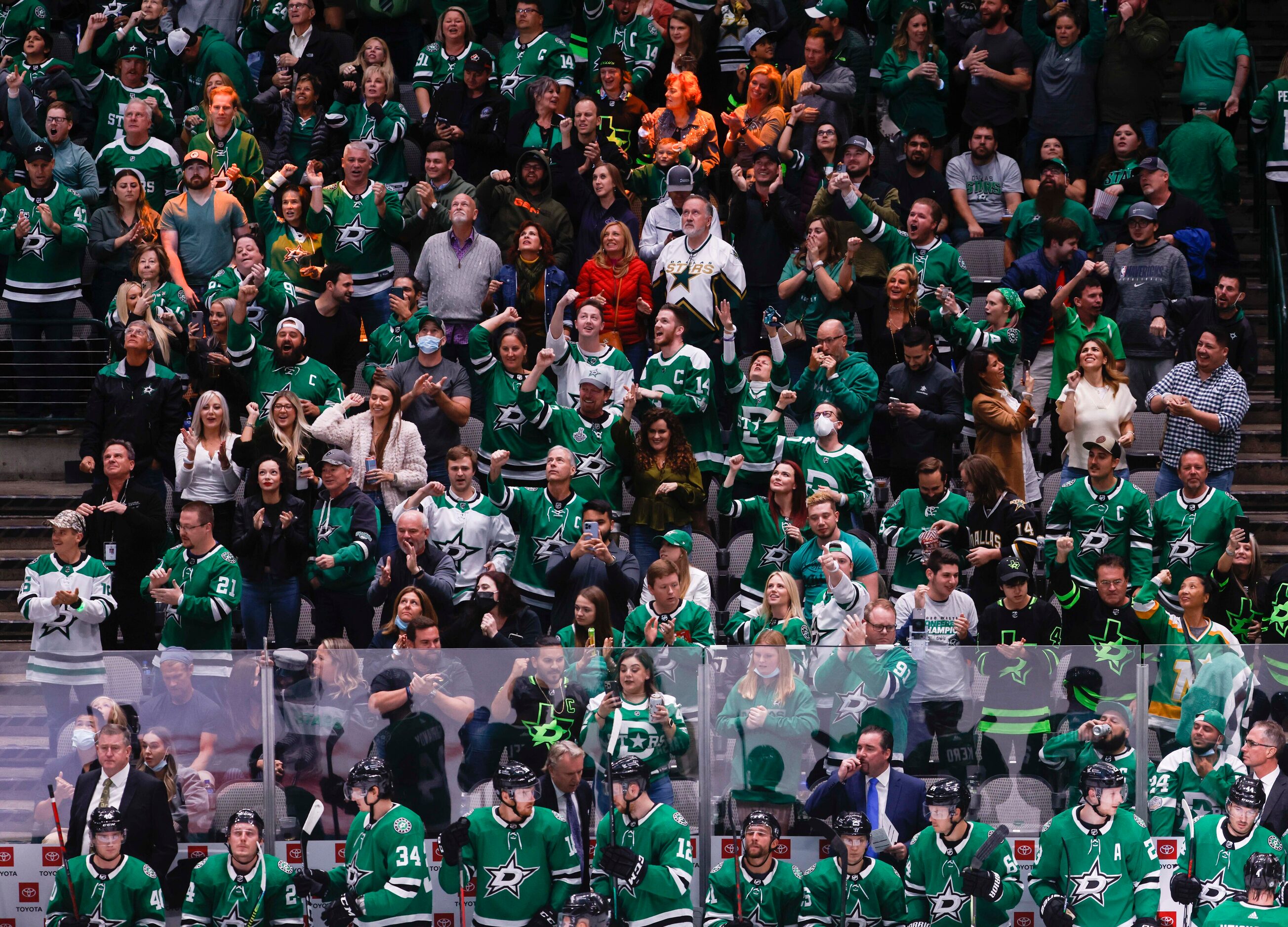 The home crowd celebrates a goal during the third period of a Dallas Stars home opener...