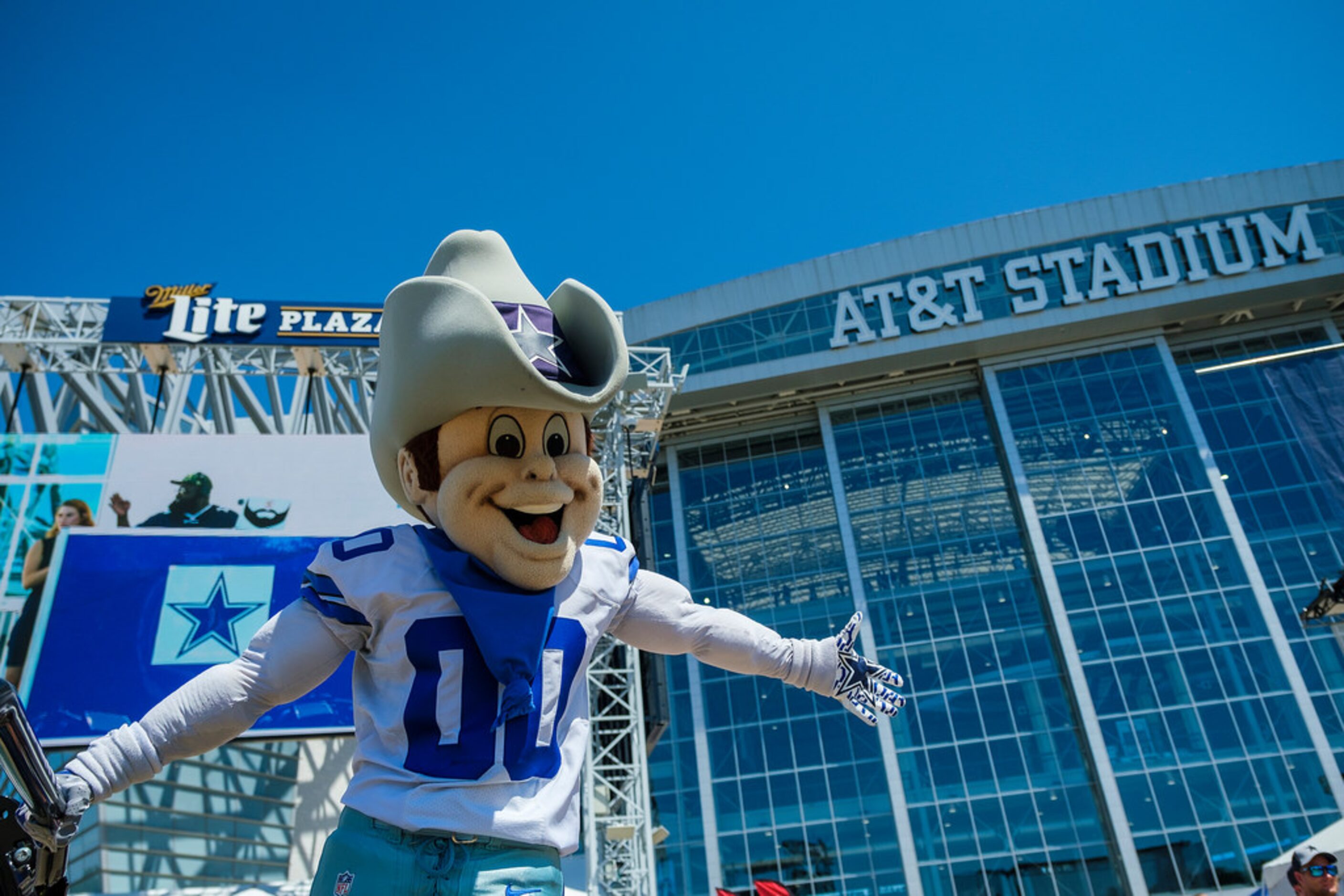 Dallas Cowboys mascot Rowdy high fives fans as they tailgate before an NFL football game...