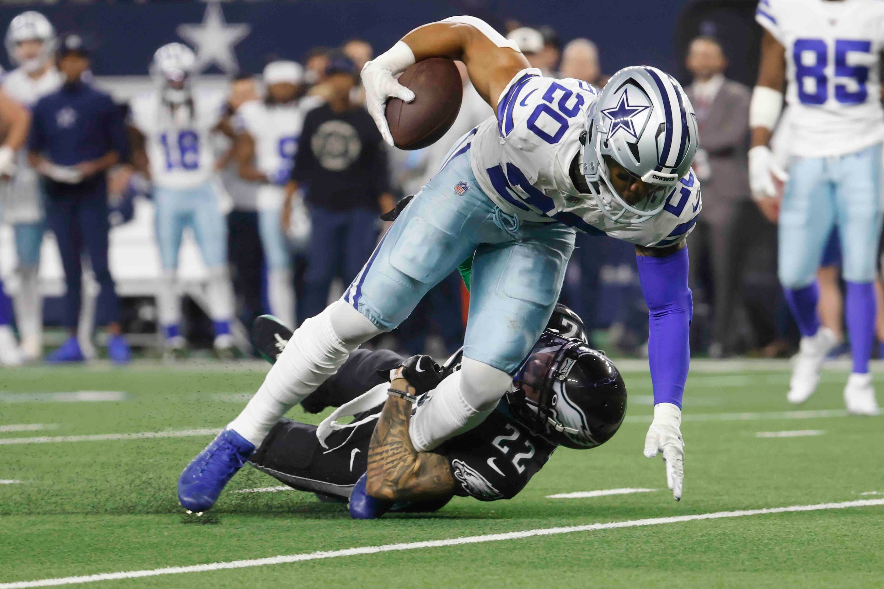 Dallas Cowboys running back Tony Pollard (20) is tackled by Philadelphia Eagles safety...