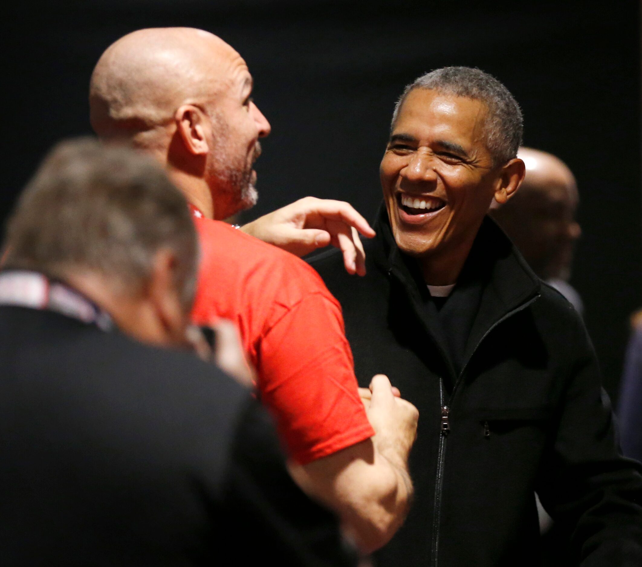 Former President Barack Obama jokes with Los Angeles Lakers assistant coach Jason Kidd as he...