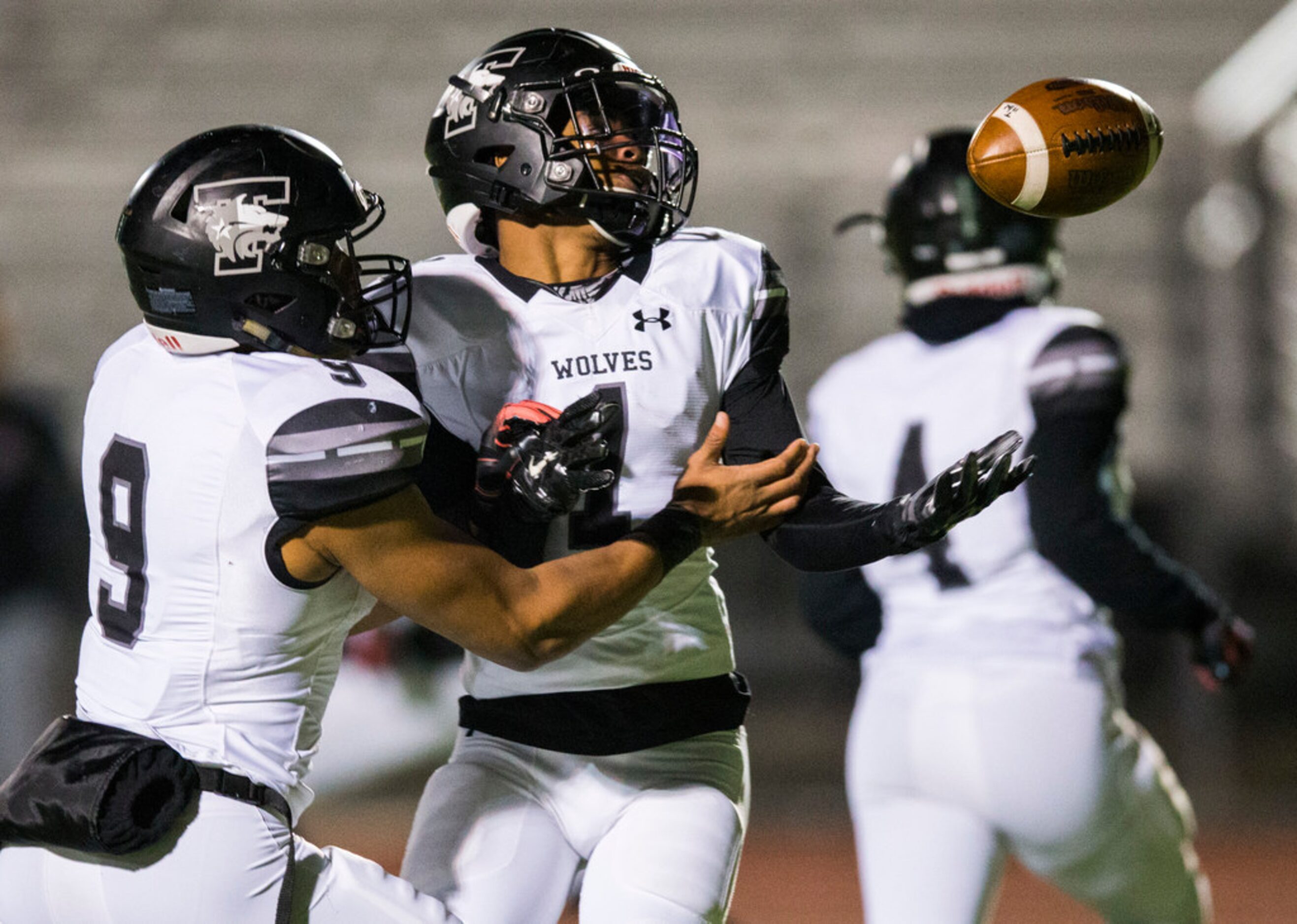 Mansfield Timberview running back Stacy Sneed (1) and Jaden Hullaby (9) watch as a bad snap...