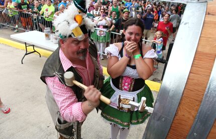 Rahr and Sons owner Fritz Rahr prepares to tap the keg at the brewery's annual Oktoberfest 5K.