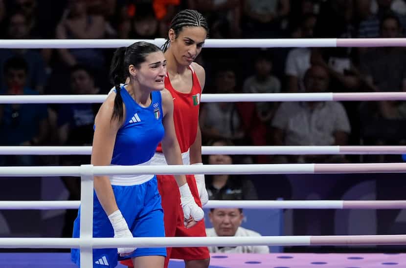 Algeria's Imane Khelif, right, defeated, Italy's Angela Carini in their women's 66kg...