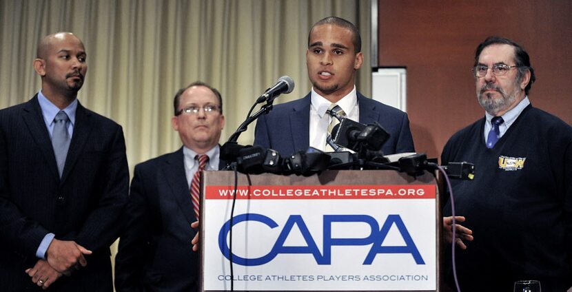 Northwestern quarterback Kain Colter second from right, speaks while College Athletes...