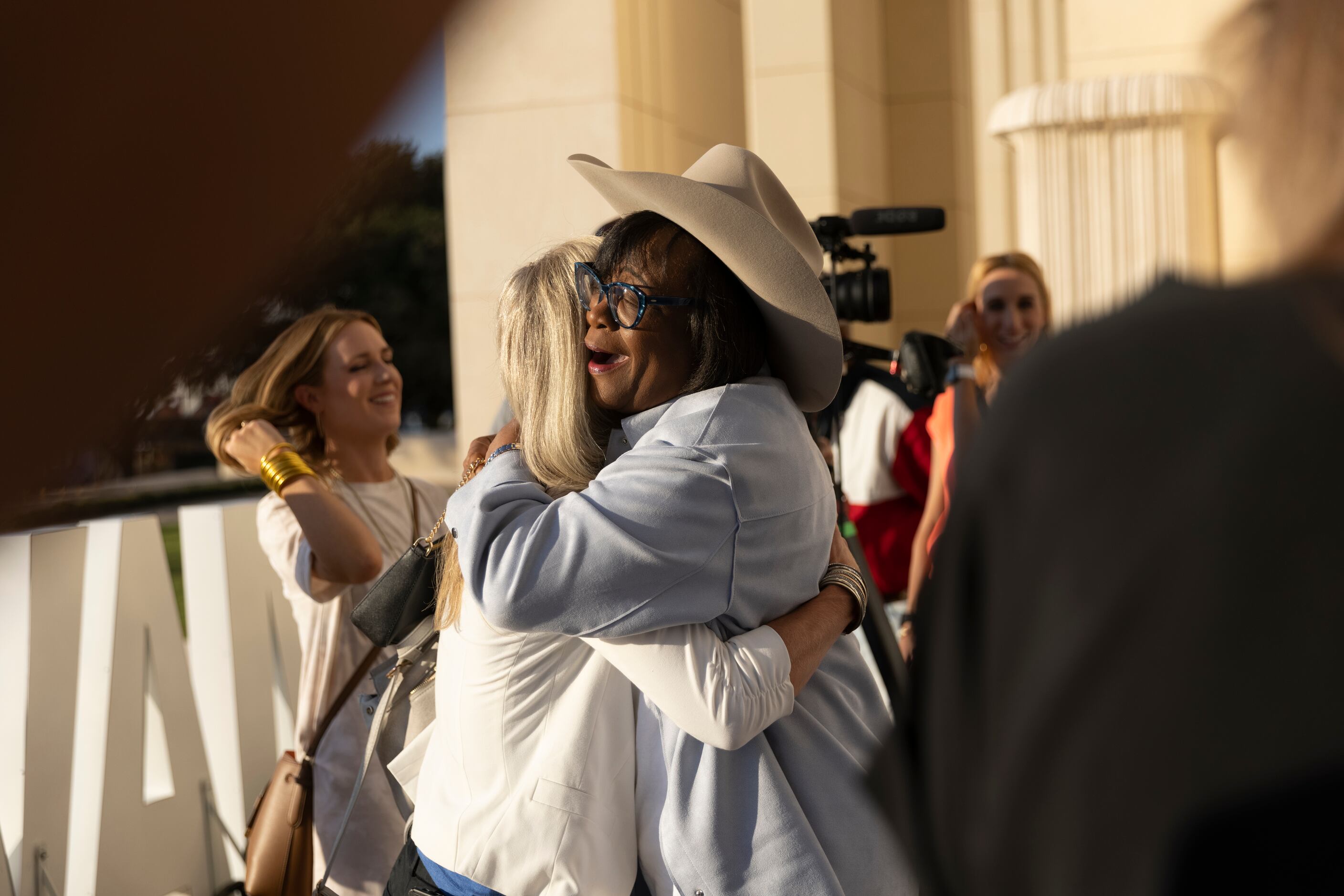 Dallas Mavericks CEO Cynt Marshall, right, hugs Sarah Melton, former Vice President of...