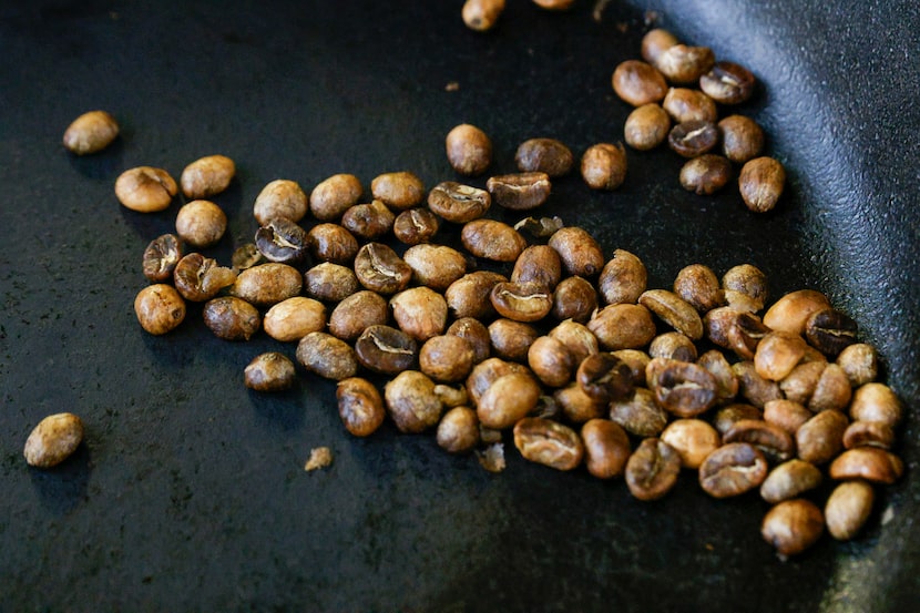 Coffee beans roast in a cast iron skillet at Ezra Coffee CEO Jessica Taylor’s apartment.