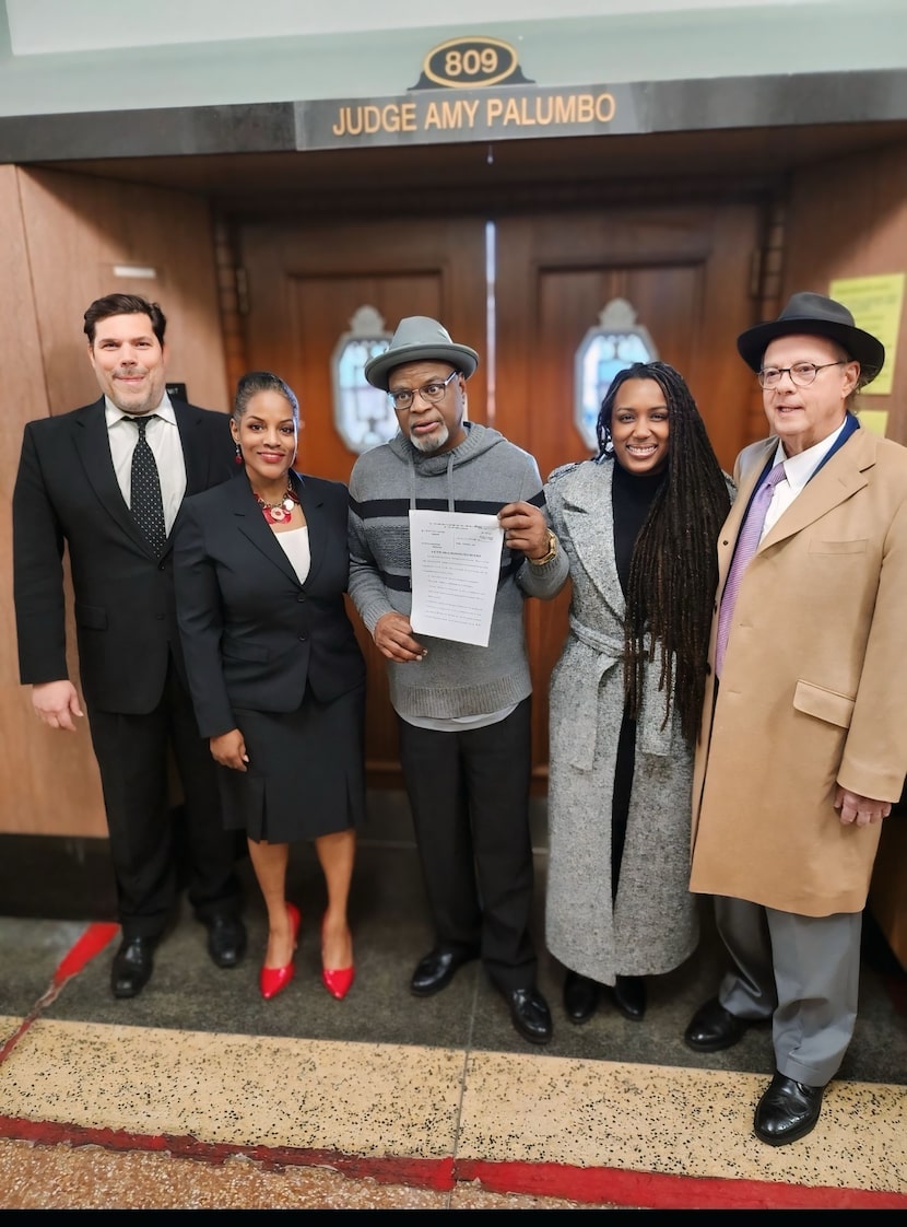 From left: Attorney Joe Norwood, attorney Kim Cole, Glynn Simmons, strategist K.C. Fox and...