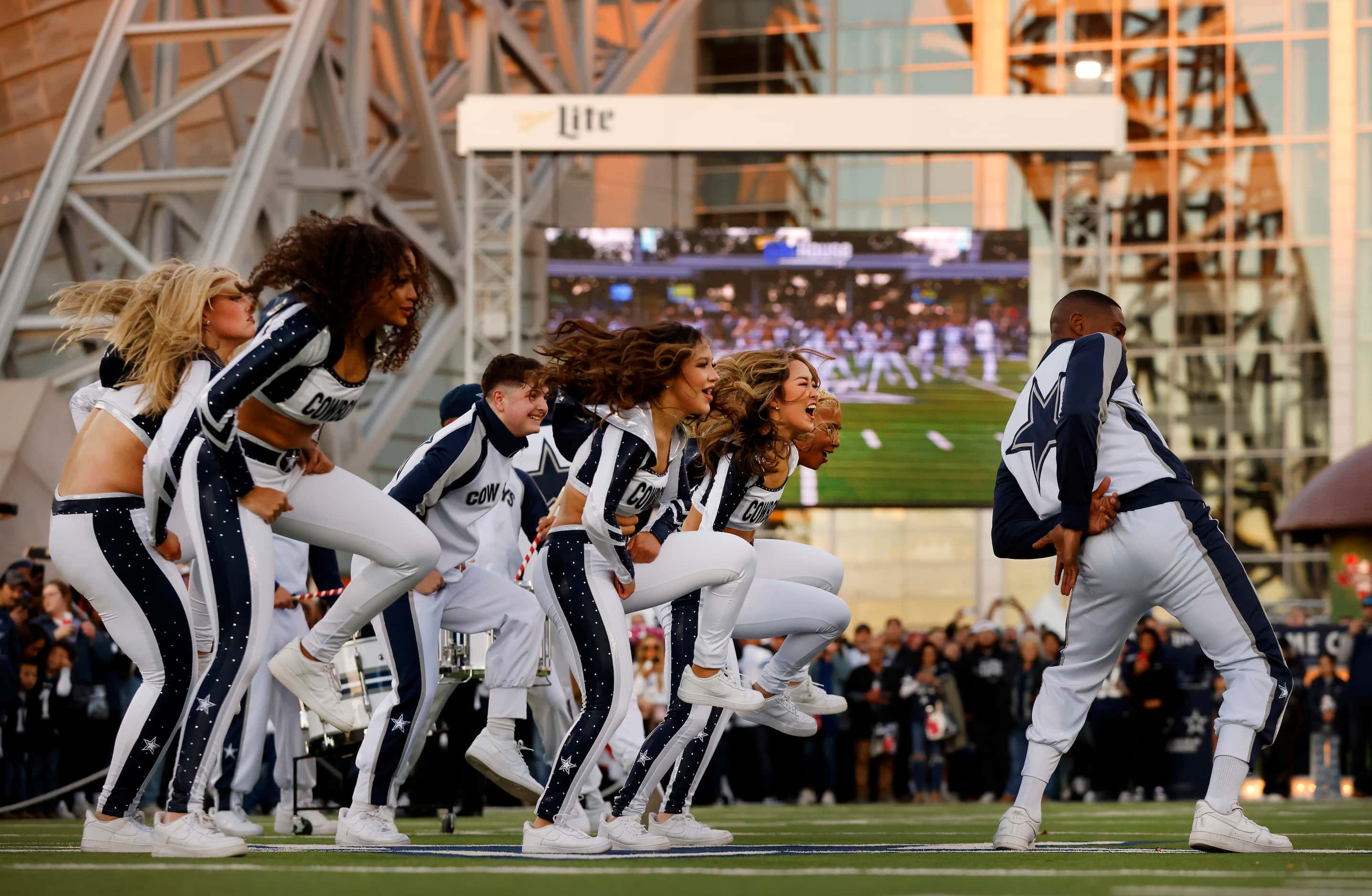 The Dallas Cowboys Rhythm & Blue drumlins and dance team perform on the West Plaza before...
