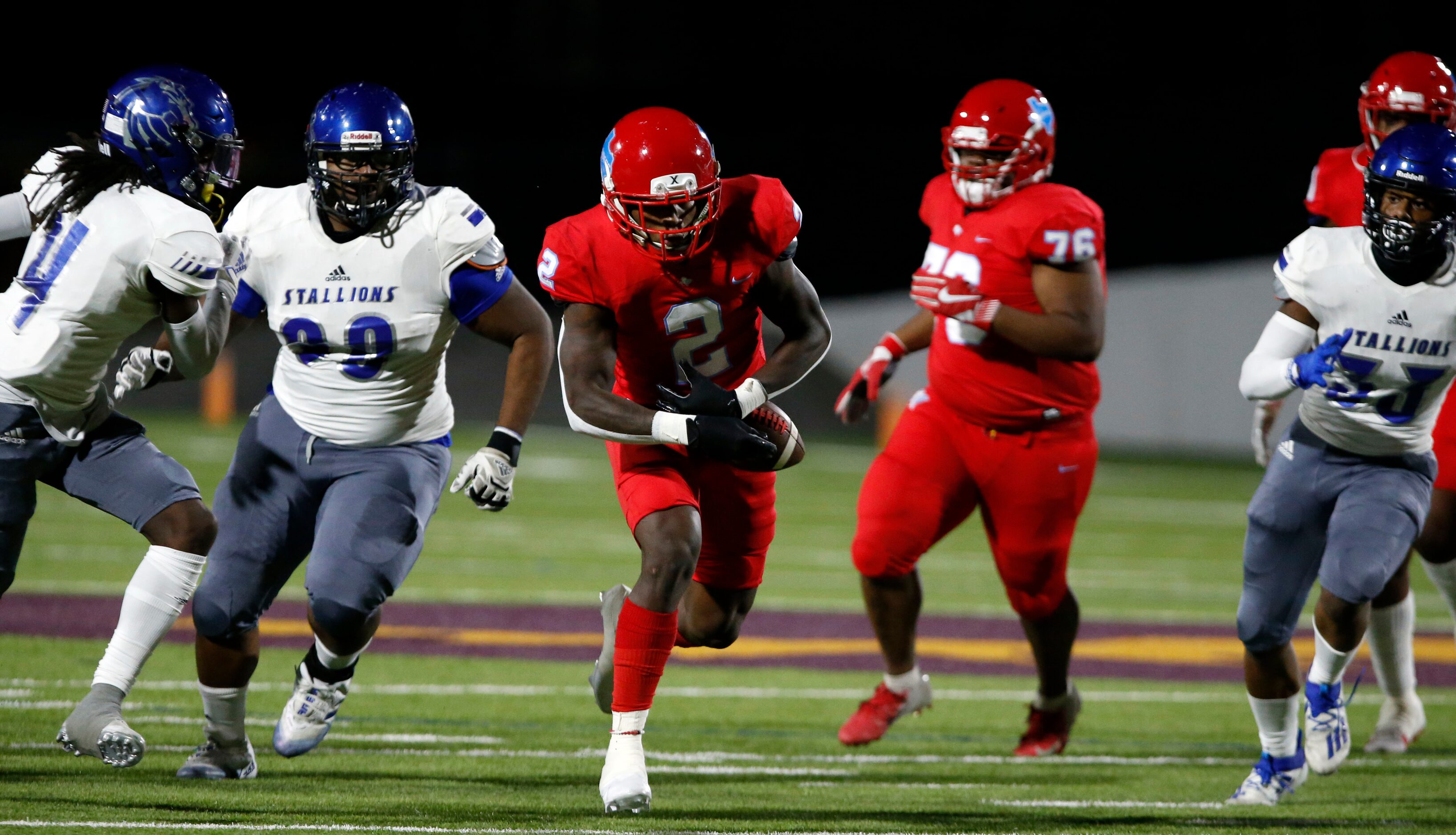 Skyline's Quaydarius Davis (2) fumbles the football in a crowd during the first half of a...