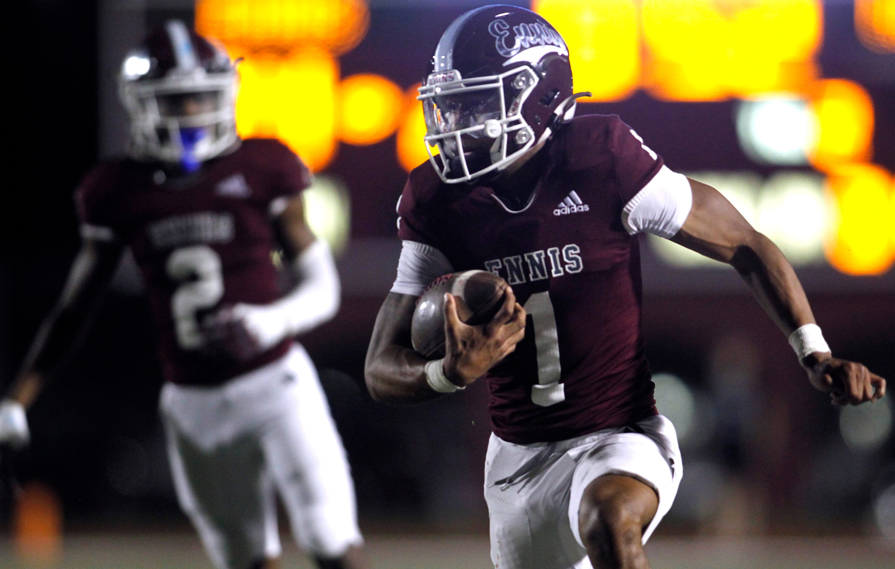 Ennis quarterback Gracen Harris (1) rushes for a first down during second quarter action...